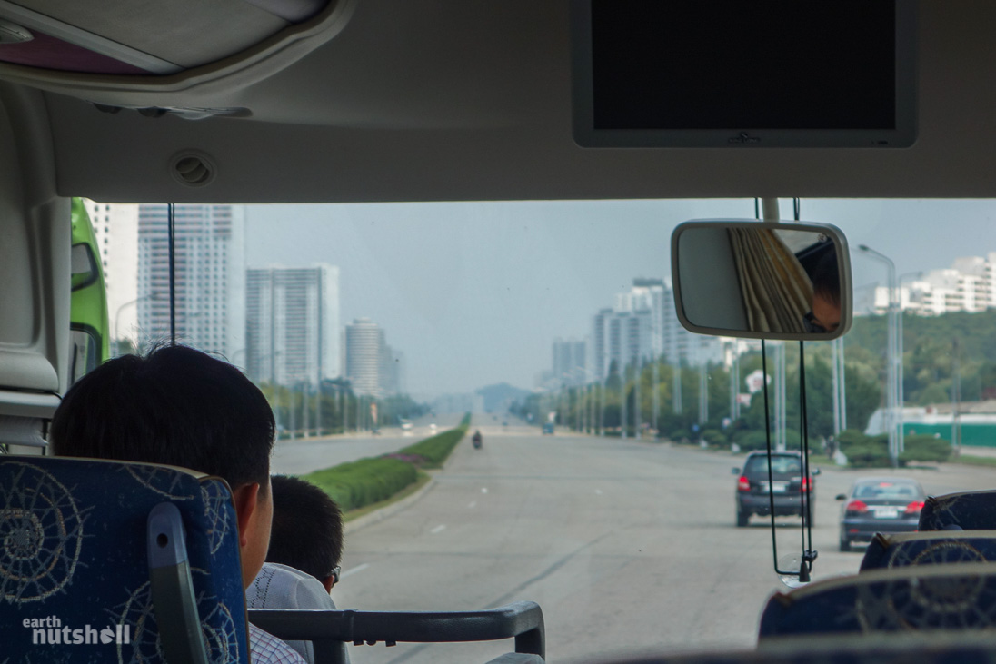 Exiting Pyongyang. Eerily desolate for a capital city. Some Chinese-made vehicles can be seen.
